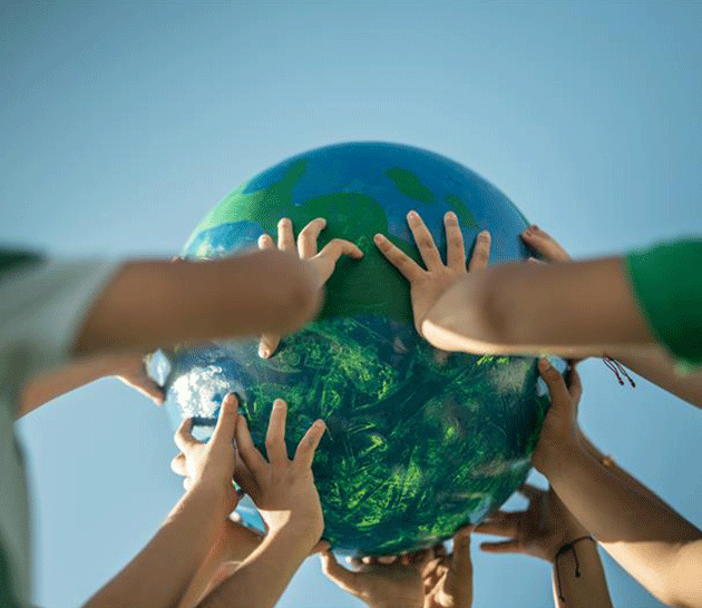 Hands holding up a globe.